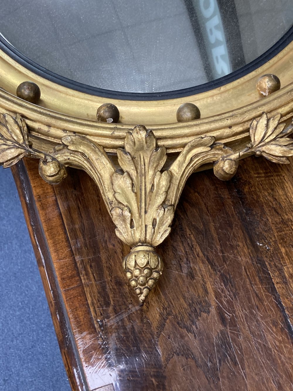 A Regency style giltwood convex mirror, diameter 50cm